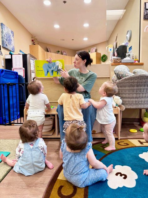 Creative-Kids-Family-teacher-reading-to-toddlers